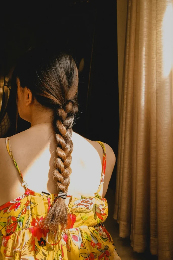 High ponytail finished with a braid down the length