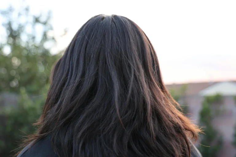 Layered haircut with natural movement and volume, back view