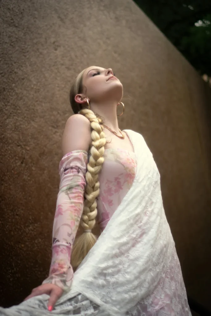 Side braid pulled over one shoulder on long hair